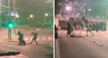 policija i mladić prosvjed Beograd