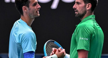Lorenzo Musetti i Novak Đoković 